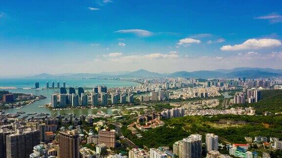 阳光明媚的一天三亚城市景观航拍全景图时间间隔4k中国