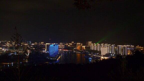 夜晚的时间照亮了三亚城市景观滨江湾山公园全景4k中国海南