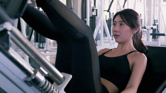 亚洲美女在健身房锻炼保健运动和运动