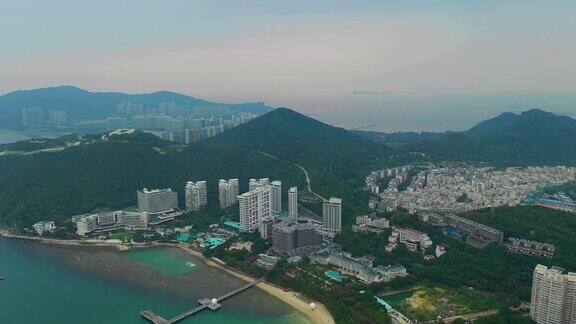 傍晚日落时间三亚市景观大东海镇湾航拍全景4k中国海南