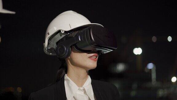 亚洲工程师戴着虚拟现实头盔
