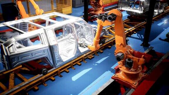 输送机的车架焊接线与未完工的车架和机器人焊接