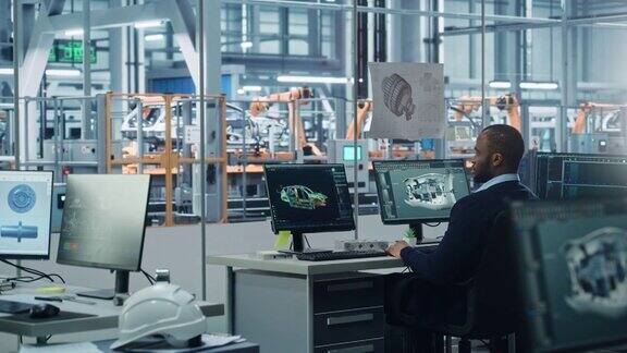 汽车工厂办公室:黑色工程师工作在桌面电脑屏幕显示CAD软件与3D涡轮发动机电动汽车制造高科技车辆的自动化机器人手臂装配线