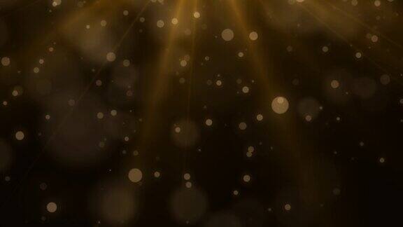 金色发光的尘埃颗粒圣诞灯散景运动模糊发光的灰尘金色的光