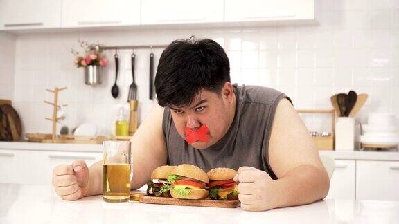 泰国超重男子因禁止吃汉堡、啤酒等不健康食品而非常生气