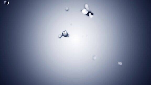 Cg动画的两个水滴碰撞飞溅蓝色渐变背景