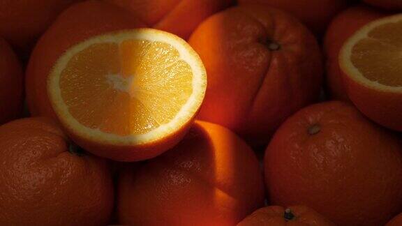 橙色水果一束光照亮了阴影中切开的橘子特写镜头