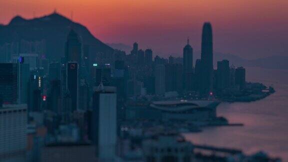 日落时间的香港城市和城市景观的日至夜时间图