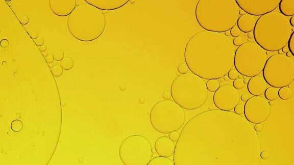 微距镜头金黄冒泡油圆球水气泡离得非常近抽象智能手机主屏风格主题背景金色球体震动震动爆炸能量源股票视频
