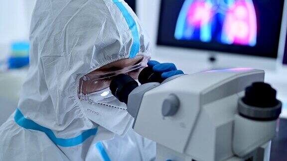 穿着防护服的科学家正在做病毒研究