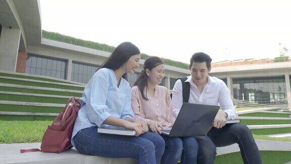 三位亚洲学生正在大学里讨论用笔记本电脑准备考试、演讲、学习、备考教育学习学生校园大学生活方式