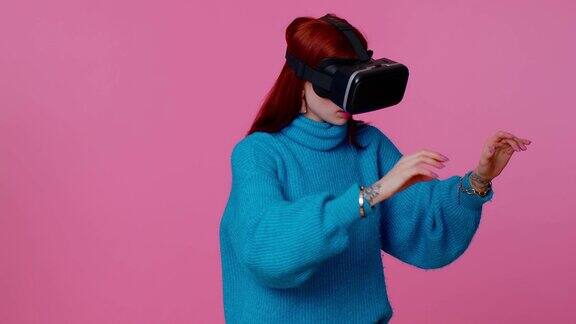 女孩使用虚拟现实未来技术VR头盔玩模拟3D视频游戏