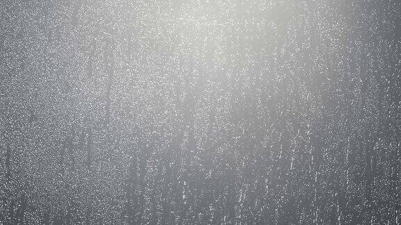 雨点落在玻璃灰色的背景上水滴落在窗户上
