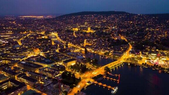 夜间照明苏黎世河城市景观湖岸航空全景4k时间流逝瑞士