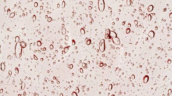 粉红色透明化妆品凝胶液与分子气泡流动微距镜头