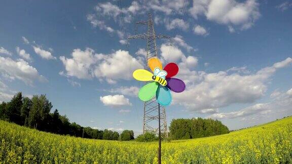 风车玩具替代能源符号和电力塔时间流逝