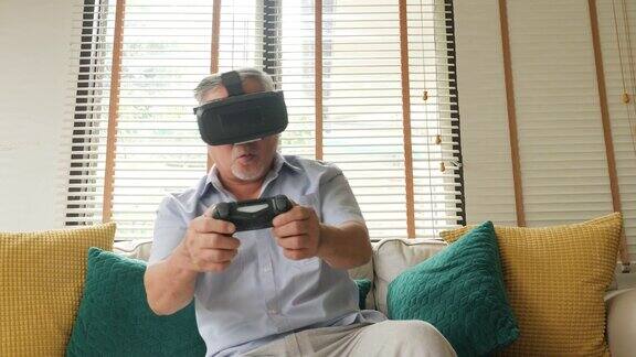 老人在家玩游戏心情愉快人们有放松、老年、退休、老年生活理念