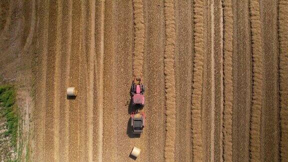 无人机拍摄的拖拉机在田野上工作