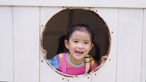 4K亚洲小女孩在公园户外游乐场玩耍的肖像