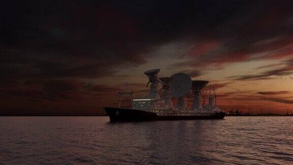 日落后一艘装有卫星天线的科学船在海上的无人机镜头