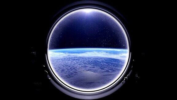 空间站在地球上方的飞行国际空间站绕地球运行从国际空间站的圆形窗口看到的地球现实的气氛星空星星4k美国国家航空航天局