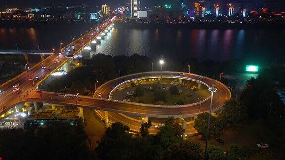 夜景照亮长沙市市中心滨江交通大桥道路交汇处4k中国航拍全景