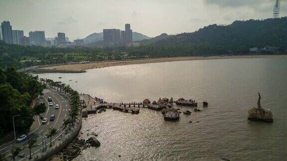 中国日落时间珠海著名渔女纪念碑湾航拍全景4k时间流逝