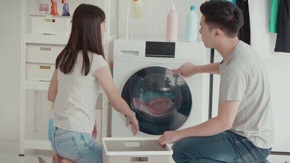 年轻夫妇在洗衣房的关系困难与冲突