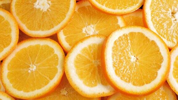 橙色水果镜头向上移动显示了许多切片的橙子特写镜头
