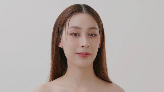 慢动作美容亚洲年轻女性模特完美清洁新鲜的皮肤护肤治疗理念
