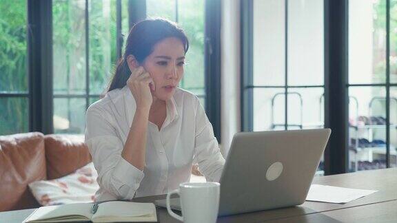 在办公室生病综合症亚洲年轻女商人在家工作有一个头痛工作压力大感觉不舒服她对分配给她的工作感到灰心丧气