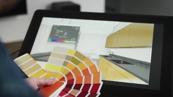 一个专业的平面设计师为室内选择颜色一个人用现代设备为设计师和建筑师工作