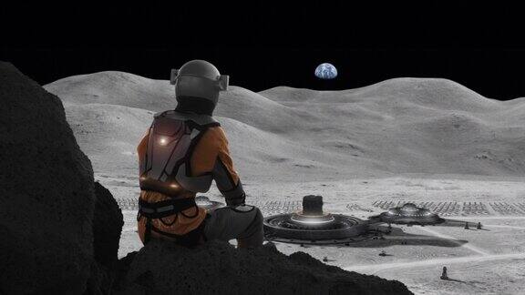 宇航员在月球上观察空间站人类在太空中的殖民地行星地球在天空