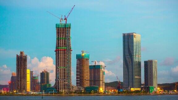 中国阳光日落珠海湾澳门城市酒店建设海岸线全景4k时间