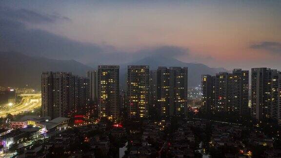 日落天空飞行在珠海城市公寓综合楼空中全景4k时间间隔中国