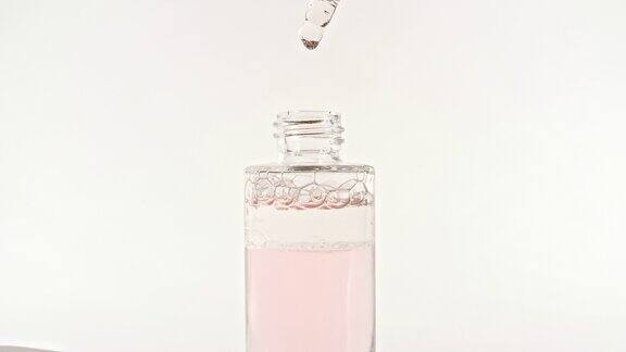 带吸管的玻璃化妆瓶设计、广告用包装样品天然有机化妆品医药生产特写慢动作