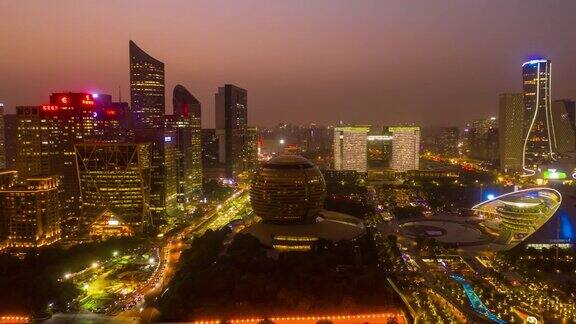 日落天空夜晚照明杭州著名的现代市中心空中延时全景4k中国