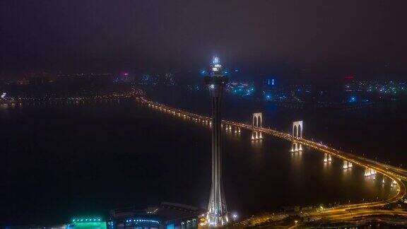 夜间时间照亮澳门城著名塔顶交通大桥道路航拍全景4k时间跨度中国