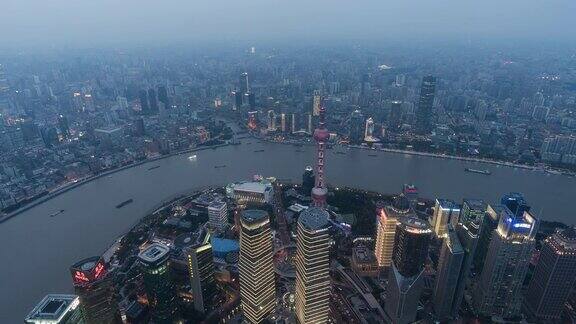航拍上海陆家嘴地区和外滩全景摩天大楼灯光秀在晚上中国