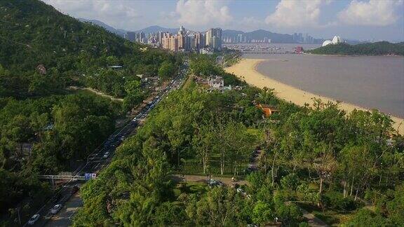 晴天珠海景山公园城市景观交通道路海滩空中全景4k中国