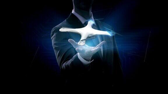 商人打开手掌旋转无人机四旋翼机未来的用户界面虚拟图形蓝色的x射线图像4k的电影