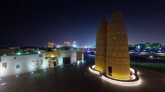 夜晚照亮多哈城市屋顶交通街道全景4k时间流逝卡塔尔