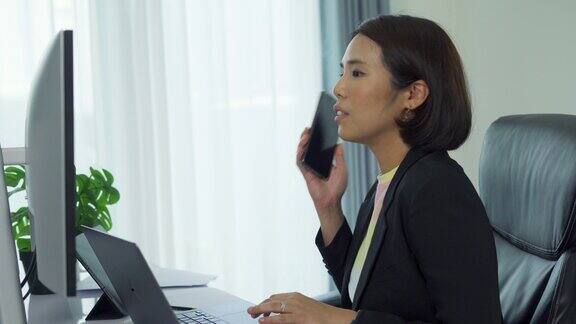 在工作场所使用移动智能手机的亚洲商业女性