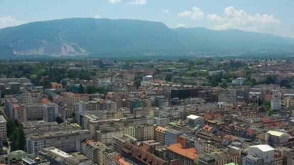 飞行在阳光明媚的一天日内瓦城市的屋顶山脉空中全景4k瑞士