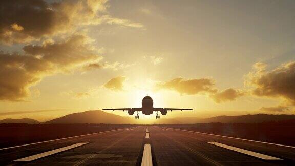 一架飞机在跑道上起飞映衬着浪漫的日落天空这是一个旅行