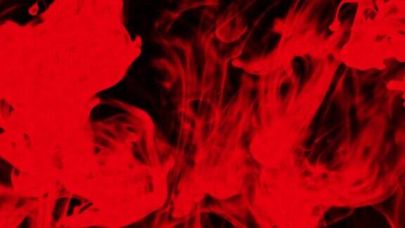 摘要红黑粒子流体在黑色上隔离的微距慢镜头油漆滴在水里混合墨水在水下旋转彩色云抽象烟雾爆炸动画3D渲染素材视频