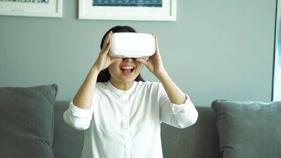 亚洲女性戴着虚拟现实头盔