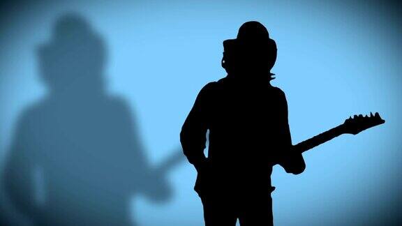 戴着帽子带着影子的酷摇滚吉他手正在蓝色背景上弹奏电吉他