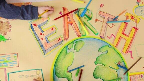 为了提高可持续发展的重要性孩子们在地球上画画和涂色