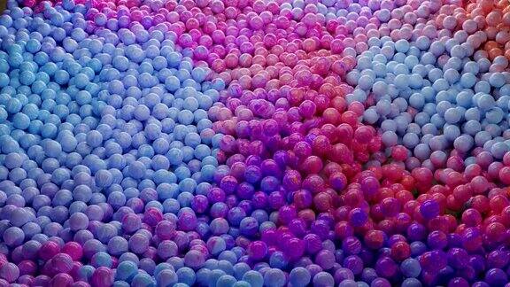 抽象动画动态移动的球渐变色彩虹色调粒子柔和的颜色小球球体或气泡颗粒球体颗粒液体物质波浪运动3d渲染